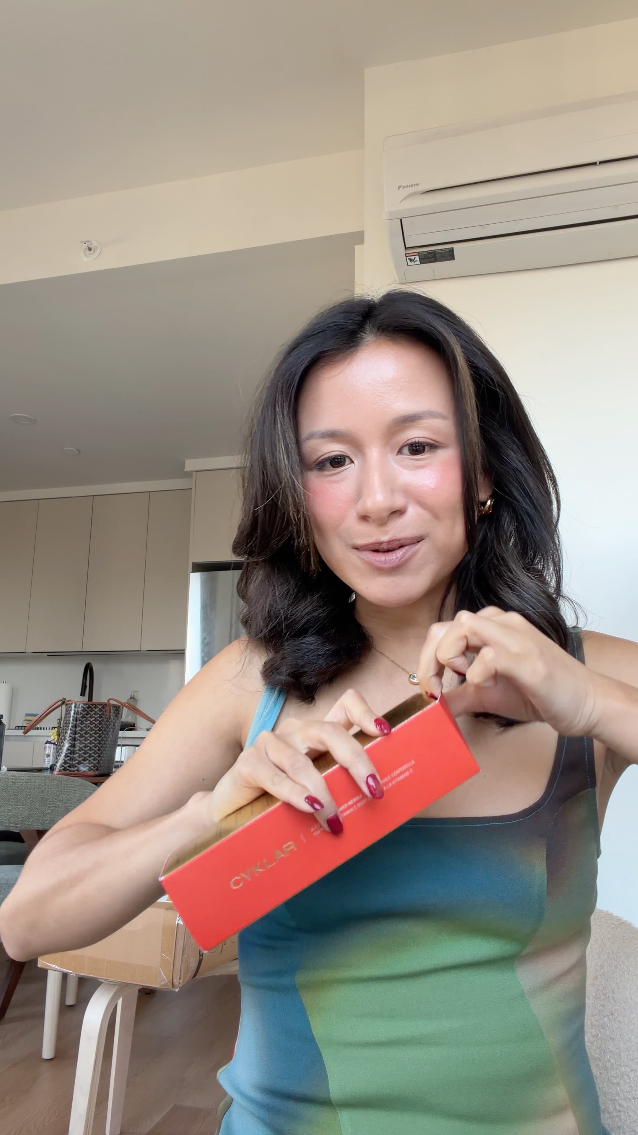 Eileen holding the Cyklar body oil box