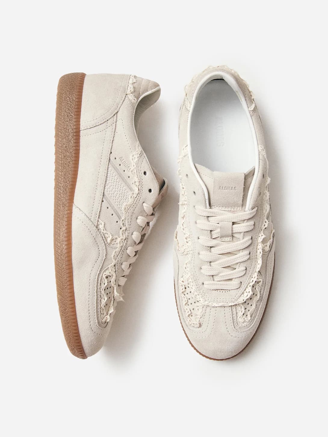 A pair of ALOHAS suede sneakers with eyelet trim