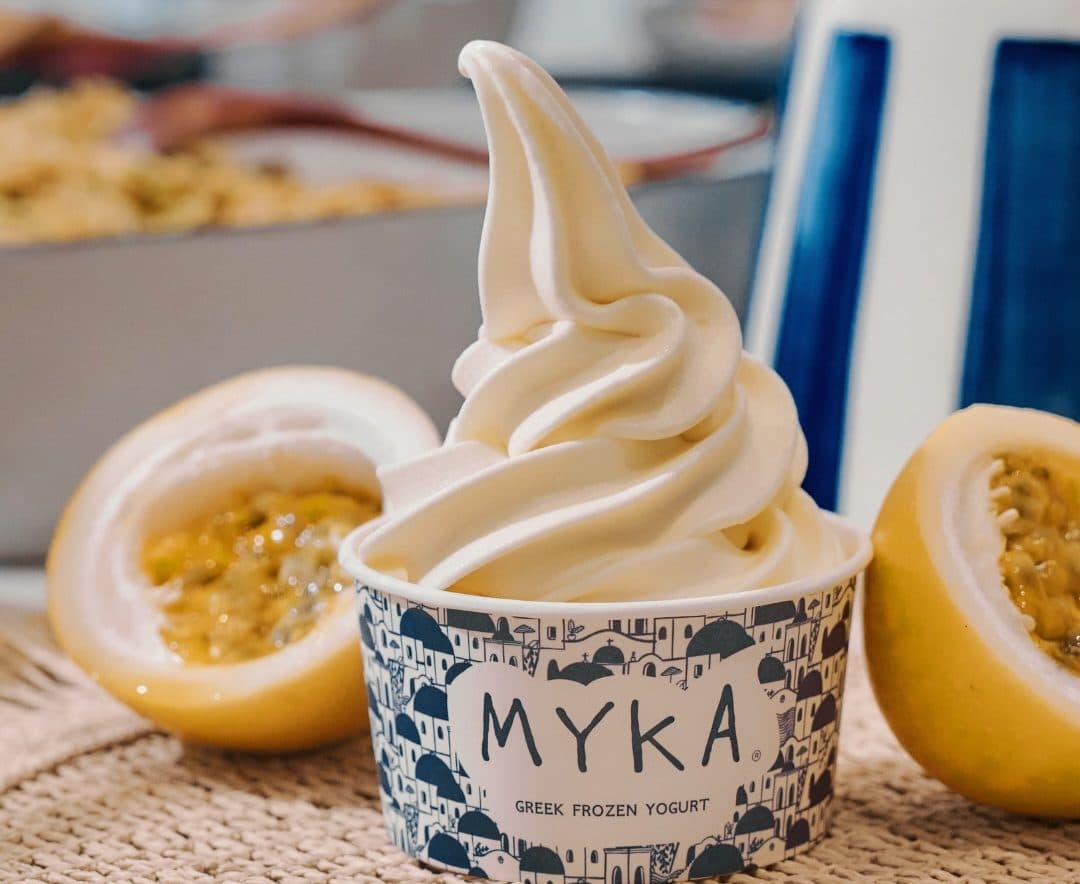 A cup of Myka frozen yogurt with fresh passionfruit