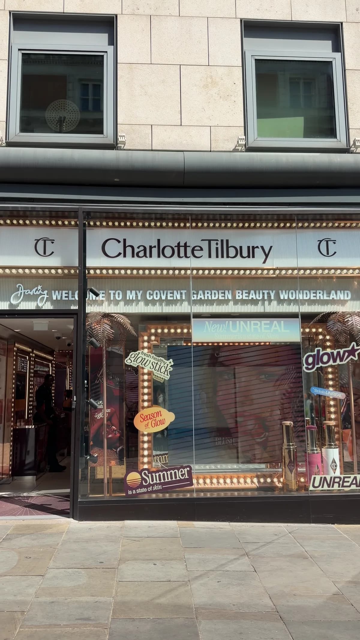 The Charlotte Tilbury flagship in Covent Garden, its bulb-lit sign reading “welcome to my Covent Garden beauty wonderland”