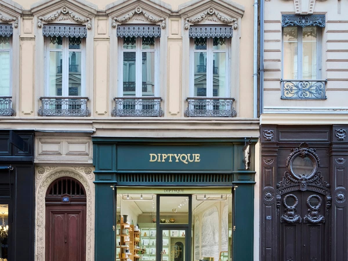 The green Diptyque boutique on a Haussmann-style street